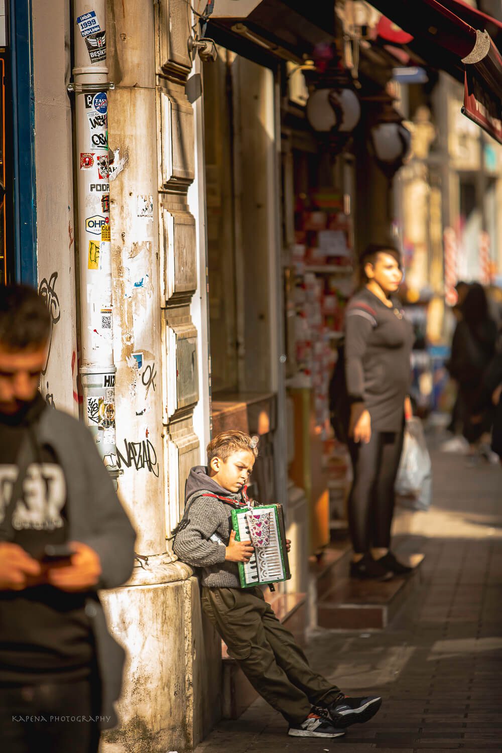 Little boy playing the accordion in Istanbul