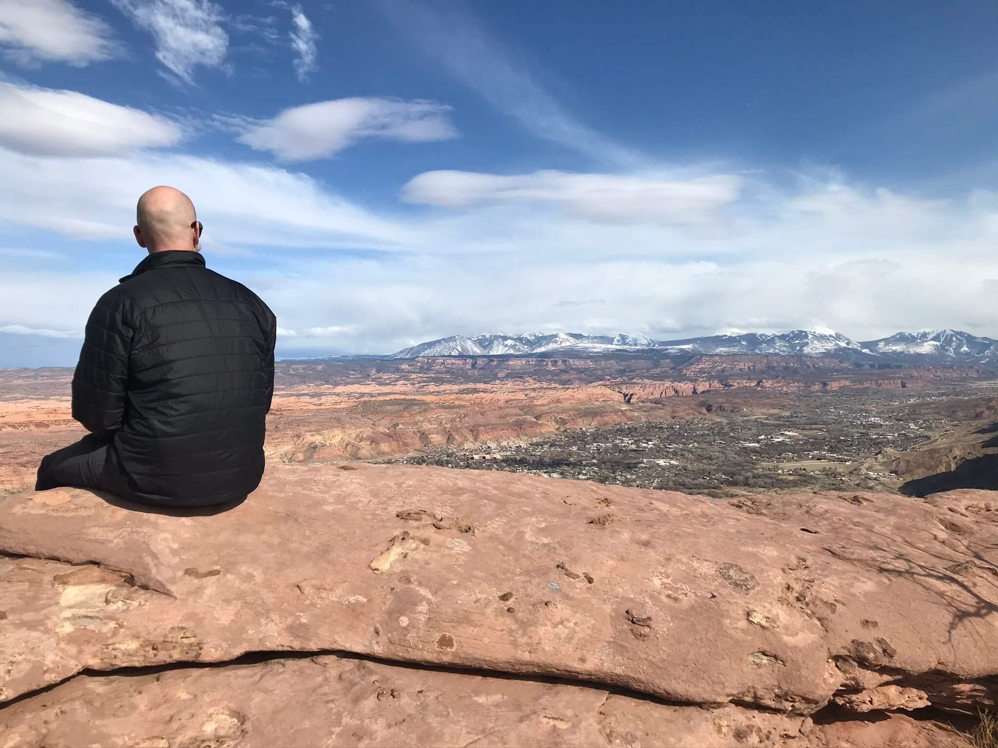Man sitting at the top of Portal Overlook Hike
